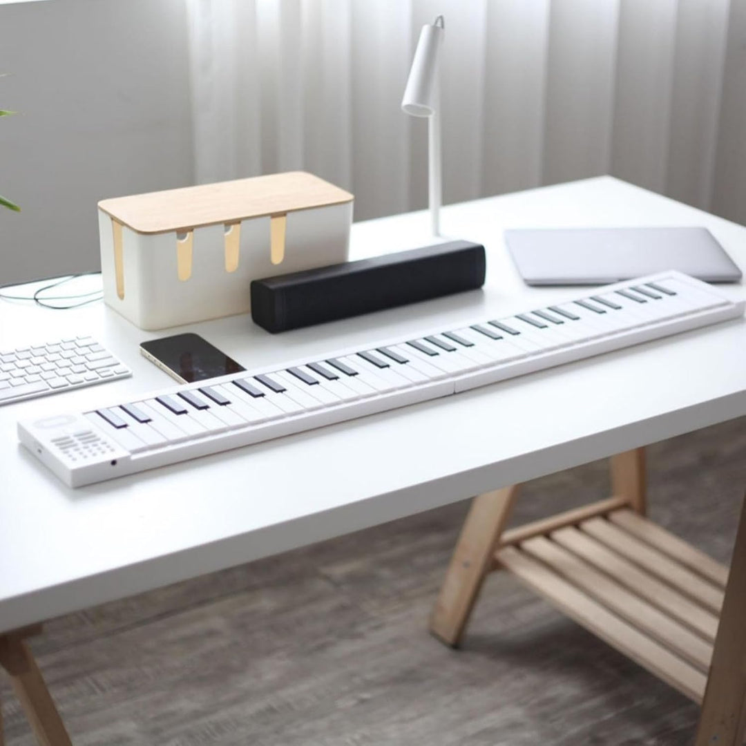 Foldable 61-Key Digital Piano, Meliora, in folded position, showcasing its compact, travel-ready design