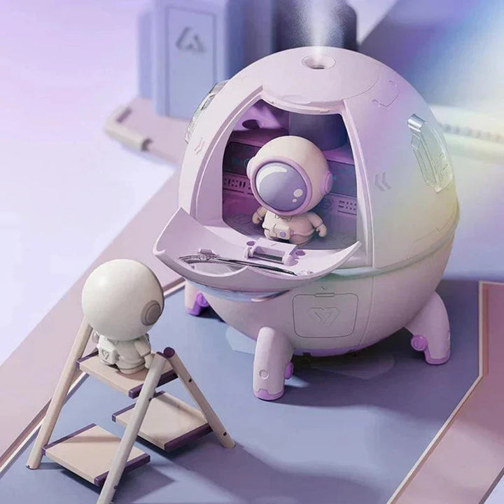 Cute astronaut humidifier & aroma diffuser with LED night light. Portable, USB rechargeable, ideal space theme decor.