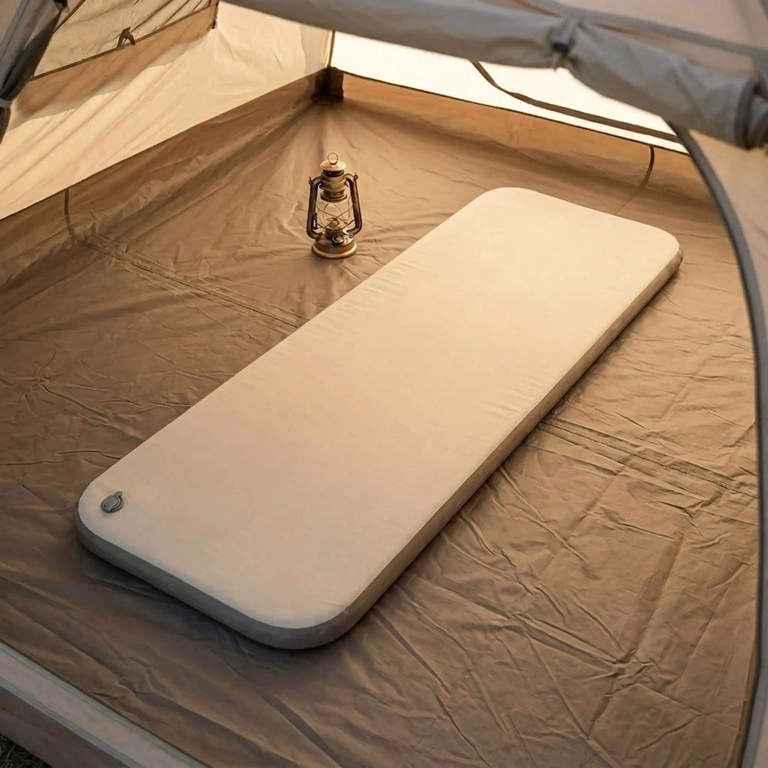 Portable camping air mattress for comfortable outdoor sleeping. Inflatable sleeping pad for hiking & guest beds.