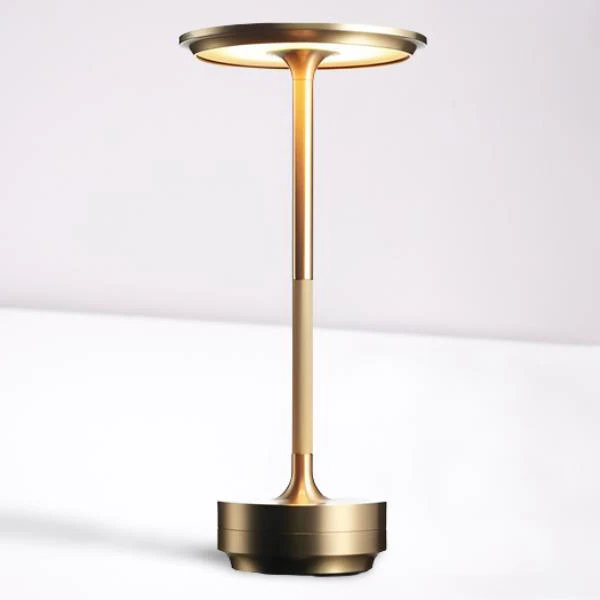 Sleek silver metal portable LED table lamp. Cordless, adjustable brightness & modern design for any room.
