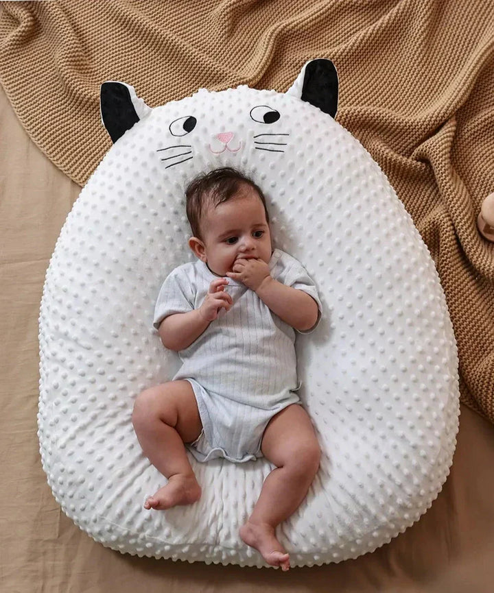 Portable ergonomic baby nursing pillow for comfortable feeding on-the-go. Ideal travel support for newborn infants.