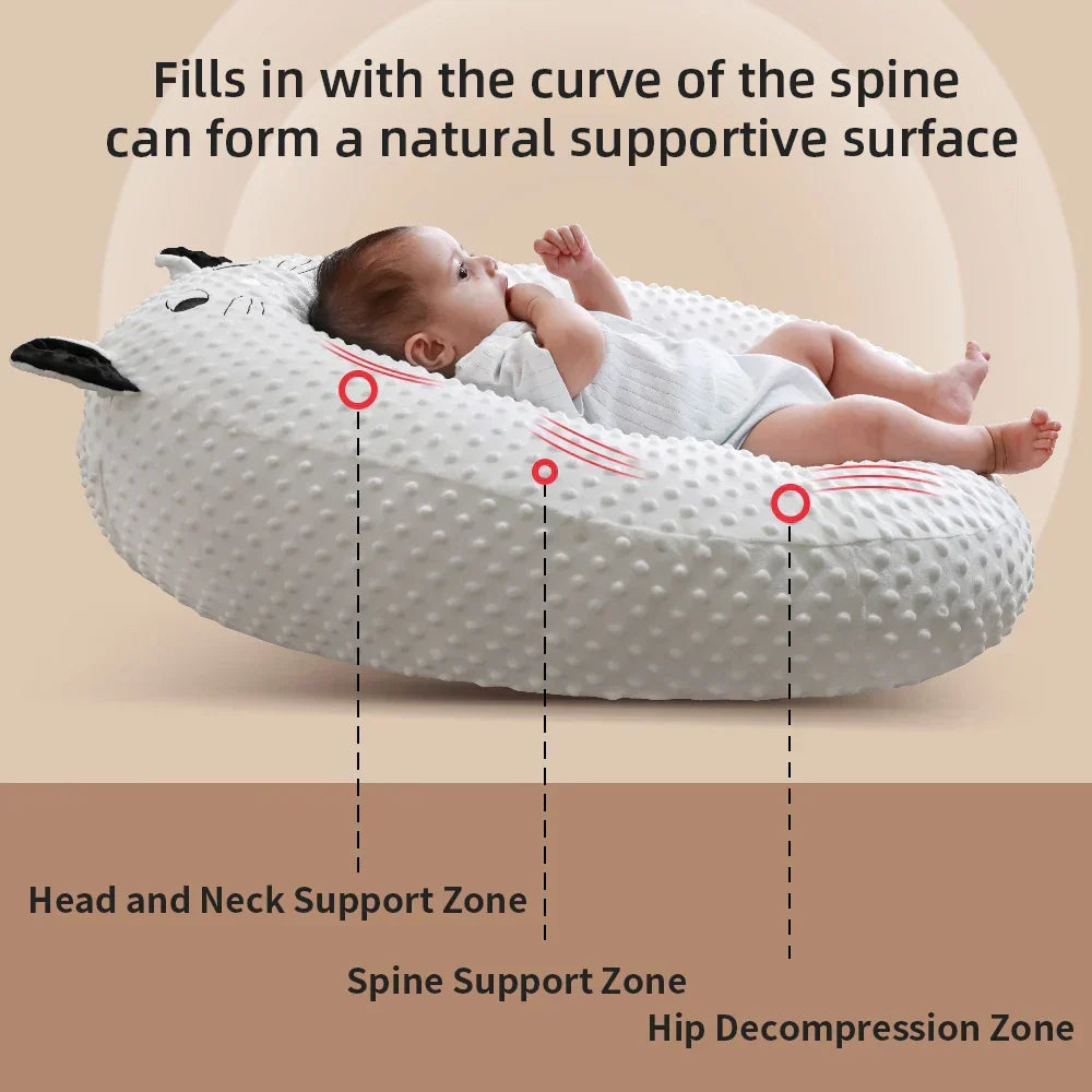 Washable portable nursing pillow for easy cleaning. Ergonomic design supports comfortable baby feeding & infant care.