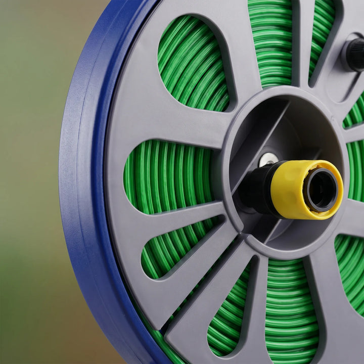 Compact garden hose reel storing flat hose neatly. Portable design saves space for outdoor yard & garden care.