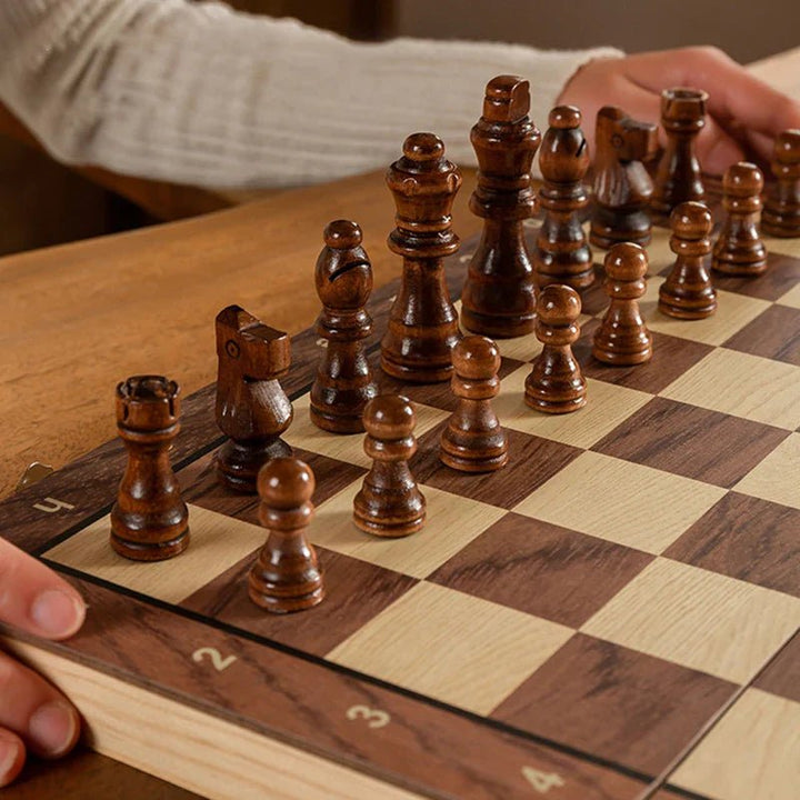Compact magnetic wooden travel chess set being played on the go, perfect for strategy game enthusiasts.