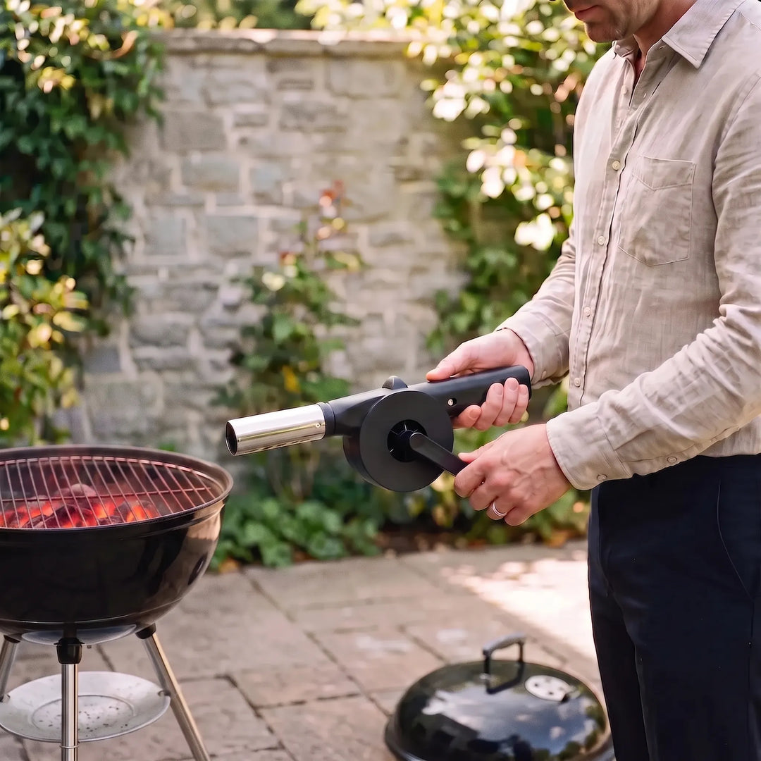 Manual BBQ fan blower for efficient quick fire starting. Essential outdoor grill accessory for charcoal & campfire.