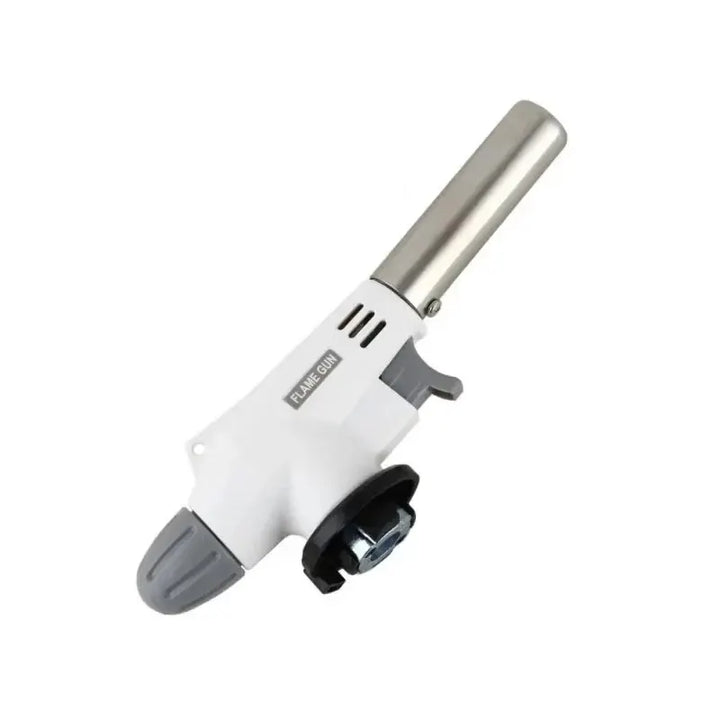 Portable metal butane gas torch igniting a BBQ grill for outdoor cooking