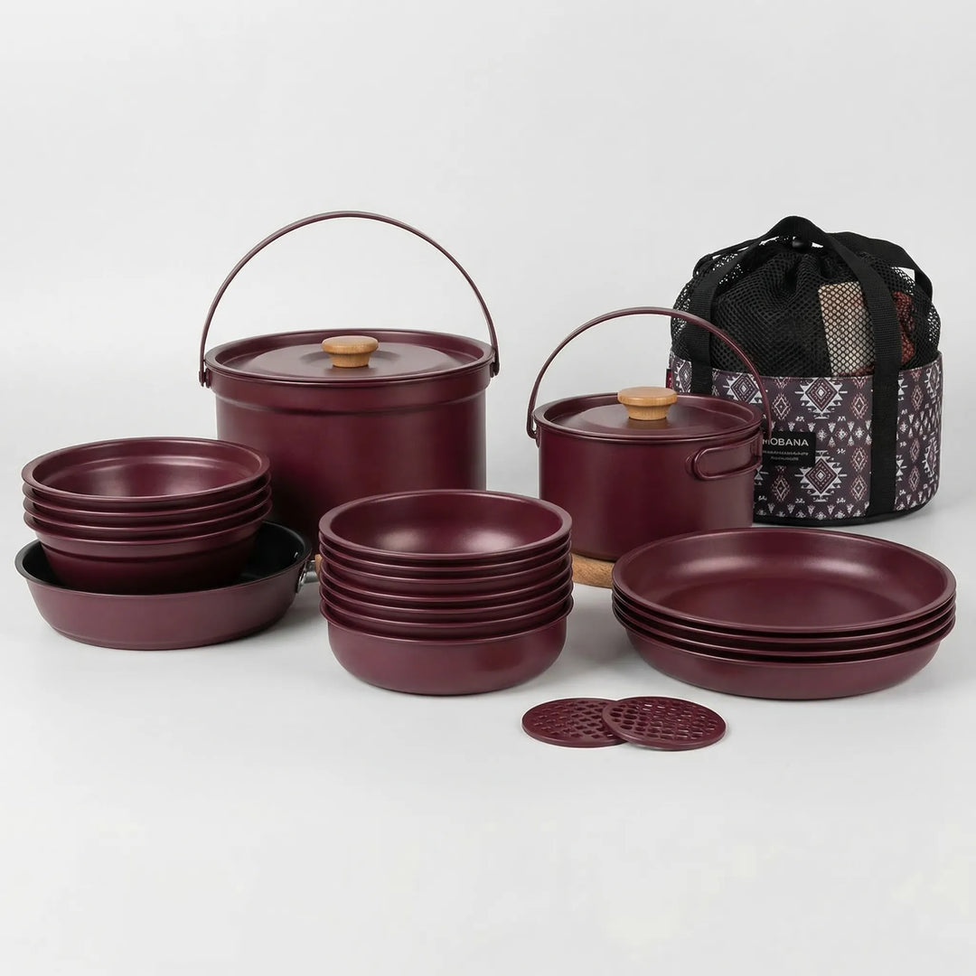 Stainless steel multi-piece camping cookware set, designed for portable family outdoor kitchen use.