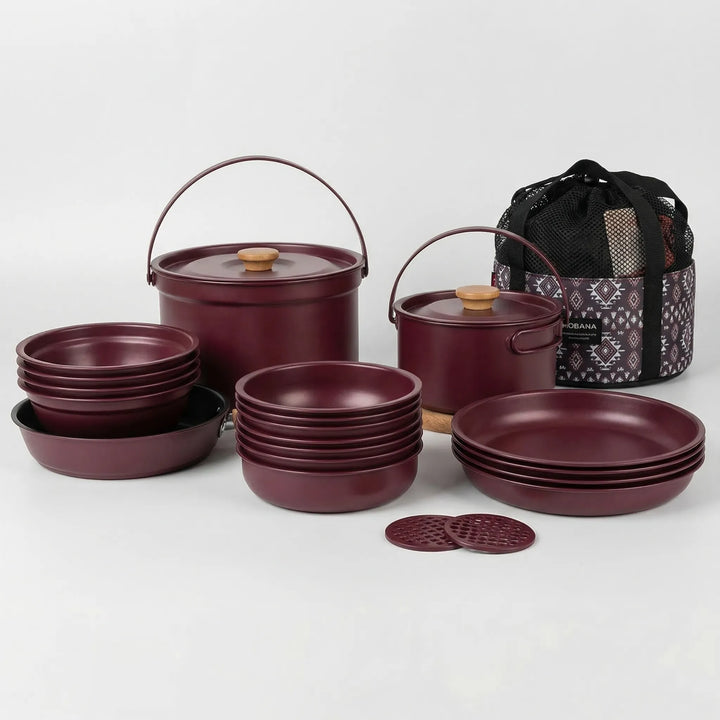 Stainless steel multi-piece camping cookware set, designed for portable family outdoor kitchen use.