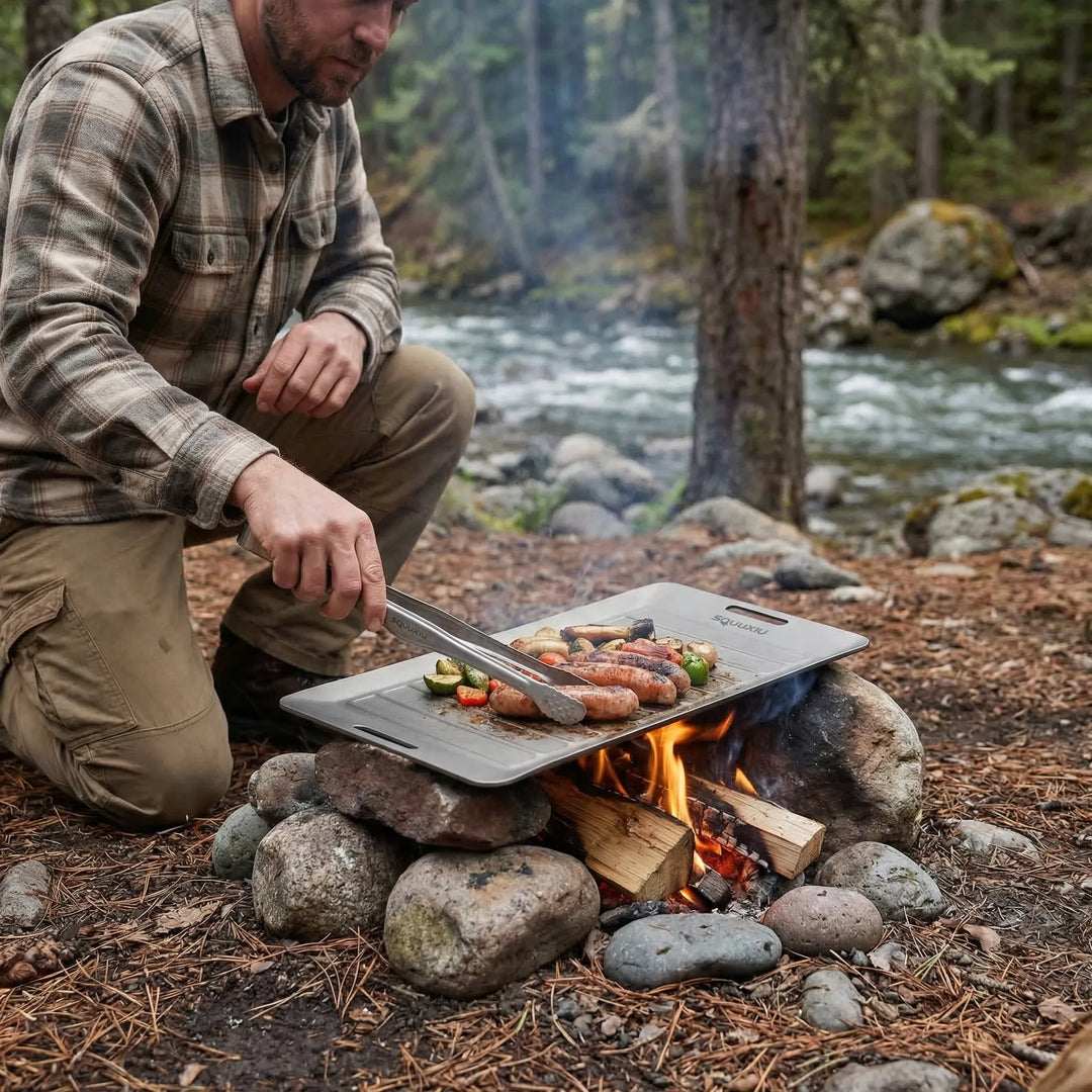 Portable non-stick camping grill plate with tongs for solo outdoor cooking & adventure meals.