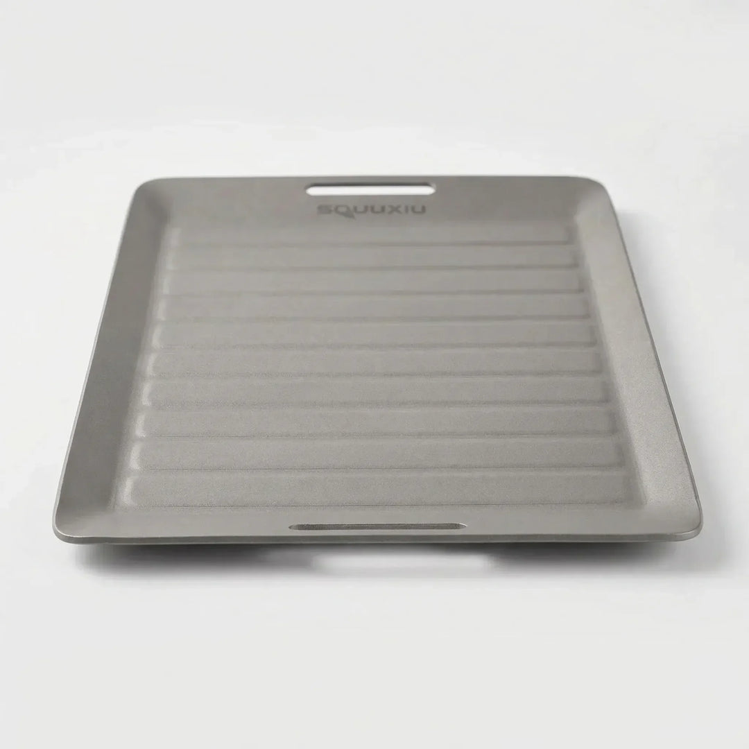 Compact solo camping grill plate & tongs for easy outdoor cooking, perfect hiking gear.