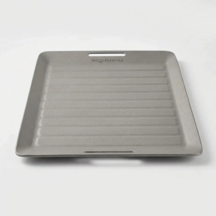 Compact solo camping grill plate & tongs for easy outdoor cooking, perfect hiking gear.