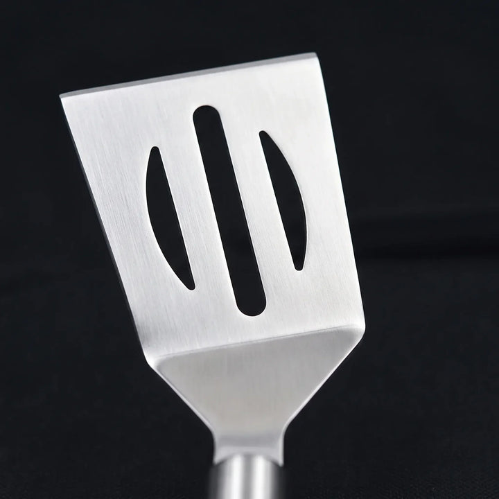 Durable stainless steel BBQ tool set, perfect for outdoor grilling, includes spatula, tongs, fork.