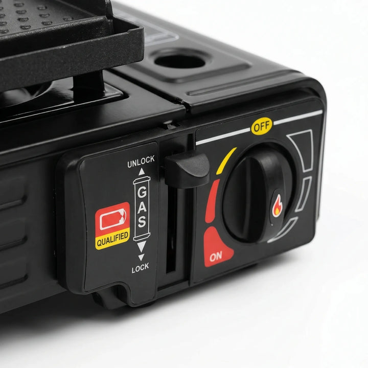Close-up of a compact two-burner propane camp stove with precise individual burner controls for outdoor cooking.