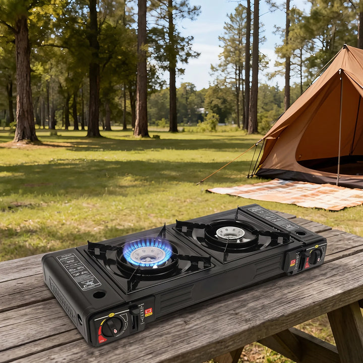 Folded portable two-burner propane stove, easy to carry for camping, hiking, and outdoor adventures. Lightweight cooktop.