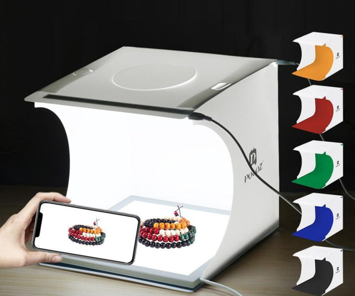 Foldable photo light box with dimmable LED lighting. Quick setup for small product photography.