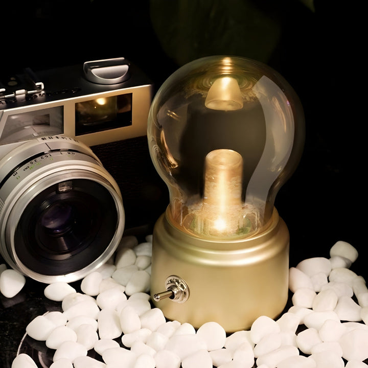 Portable retro LED table lamp with USB charging, emitting warm ambient light, perfect for home decor.