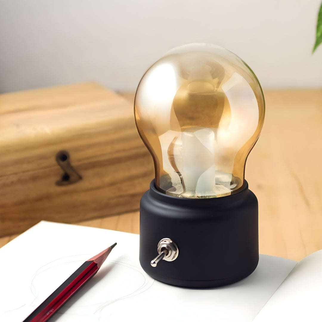 Close-up of a vintage-style portable LED table lamp, showcasing its unique design and soft light for night.