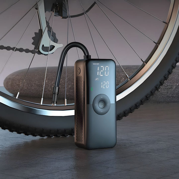 Portable smart tire inflator pump for bikes & sports gear, features digital display & USB-C. Fast & compact.