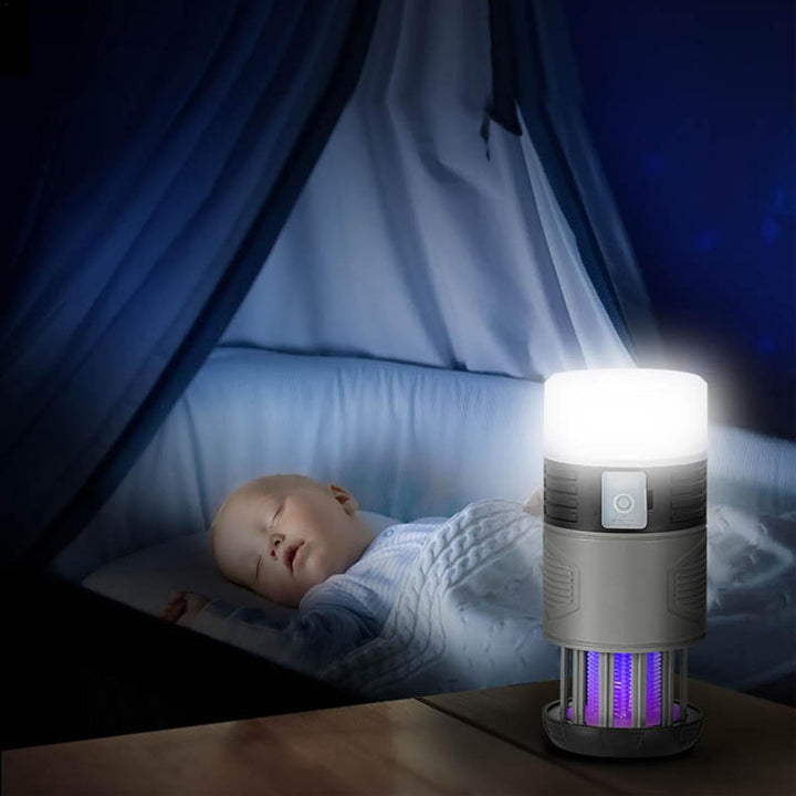 Solar-powered insect killer operating at night, showing the glowing UV lamp attracting mosquitoes and flies
