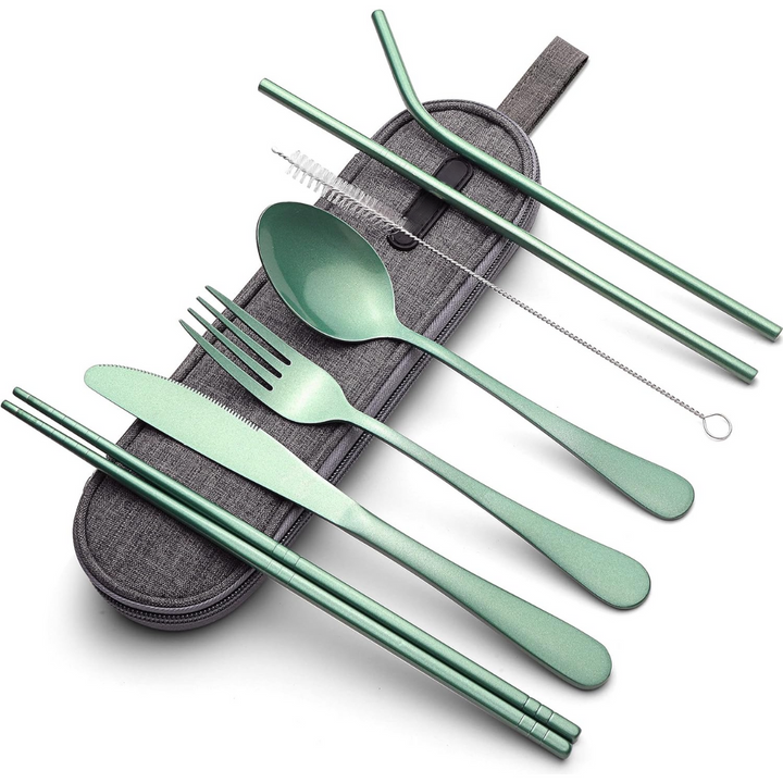Portable stainless steel cutlery set on a picnic blanket, highlighting its use for outdoor and travel dining