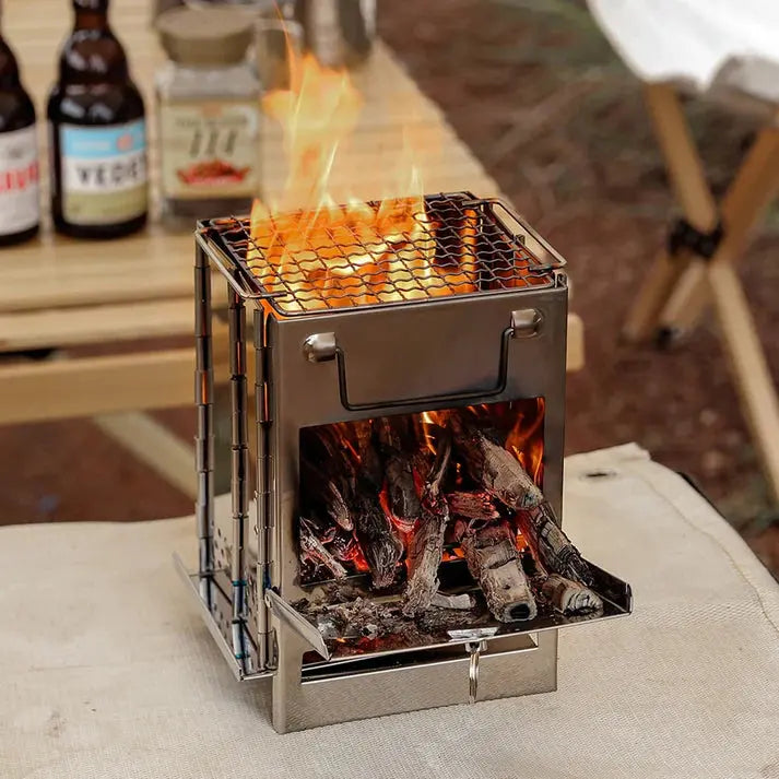 TrailFlame portable foldable wood stove, stainless steel, for reliable outdoor camping & cooking.