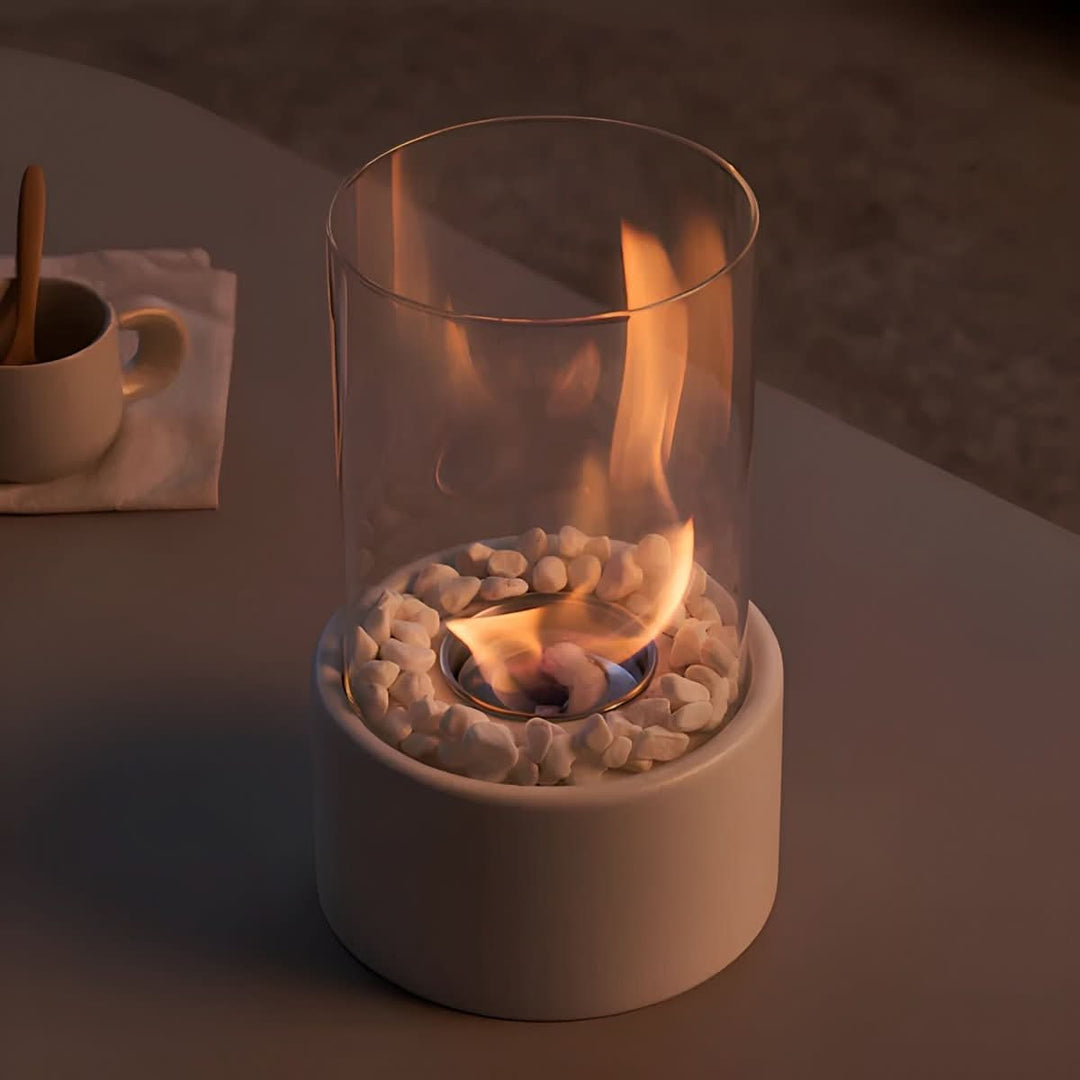 Sleek portable tabletop fireplace, creating a modern and stylish indoor/outdoor flame feature.