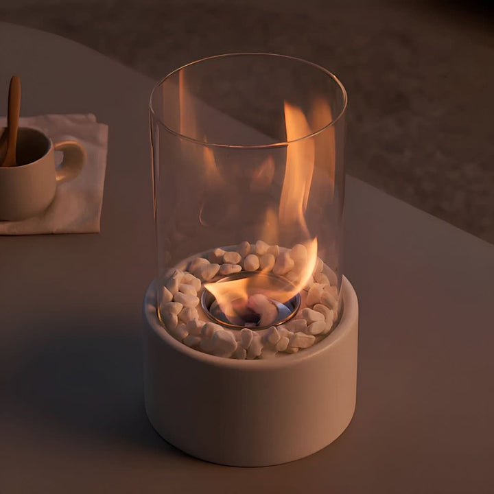 Sleek portable tabletop fireplace, creating a modern and stylish indoor/outdoor flame feature.
