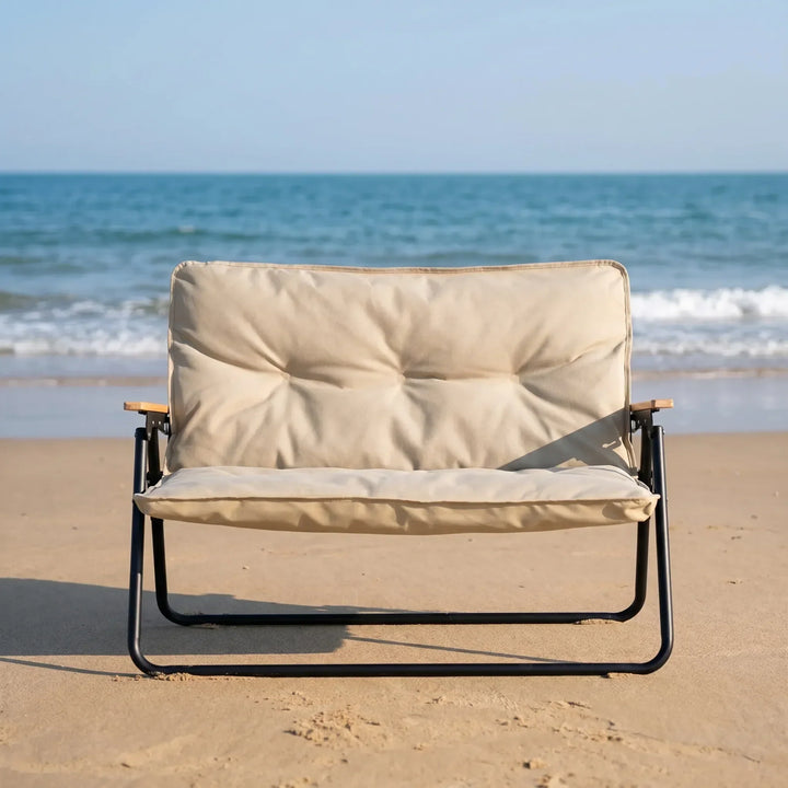 Portable two-person camping sofa, foldable for easy transport. Ideal outdoor seating for camp comfort.