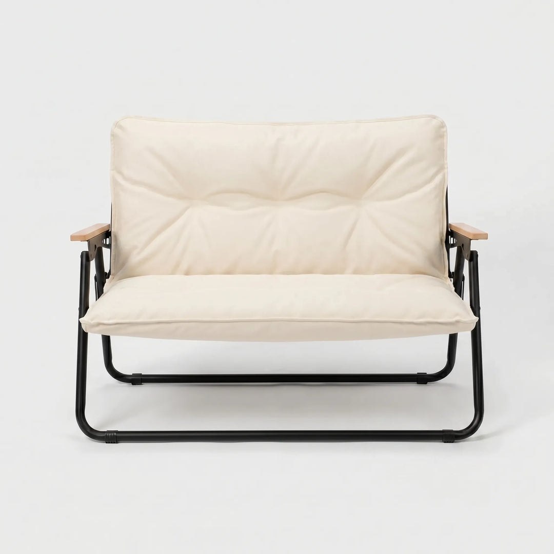 Comfortable two-person outdoor sofa, perfect for relaxing at a campsite or patio. Durable camping furniture.