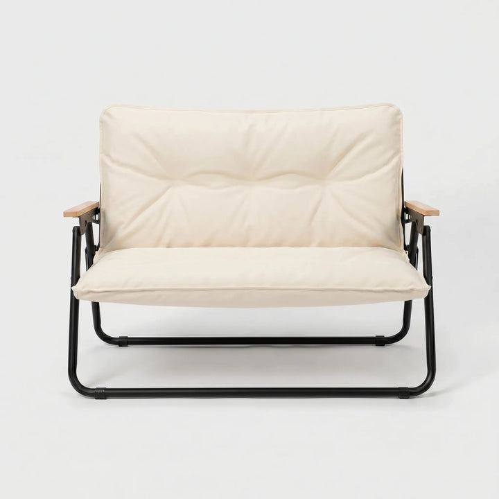 Comfortable two-person outdoor sofa, perfect for relaxing at a campsite or patio. Durable camping furniture.