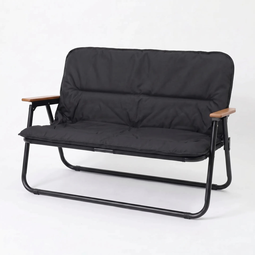 Lightweight two-person travel sofa, a folding bench for comfortable outdoor seating on camping trips.