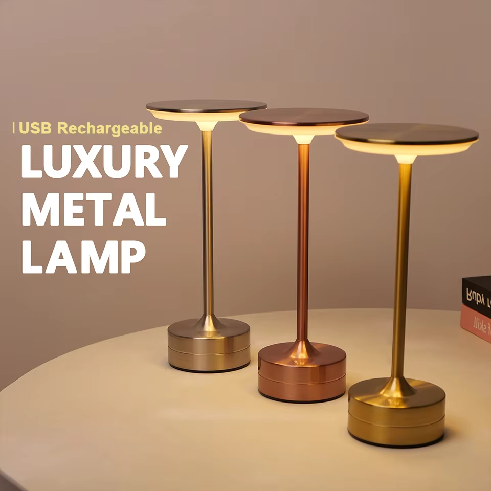 Sleek LED table lamp, touch sensor activated, USB rechargeable, provides warm ambient lighting.