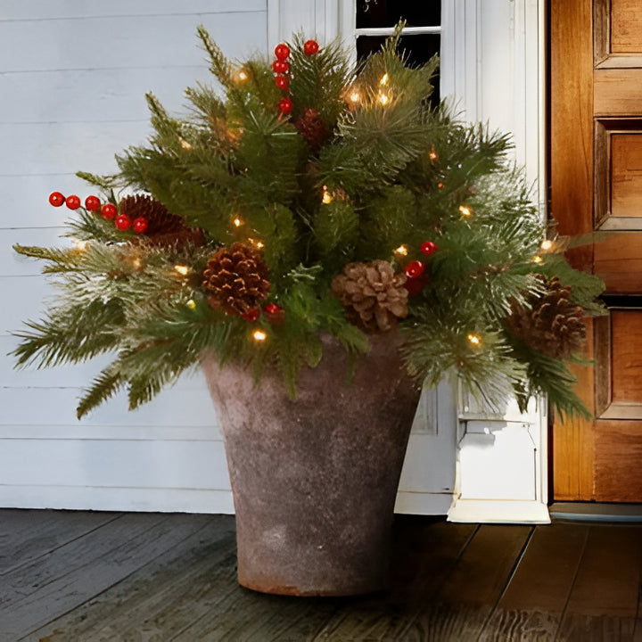 Pre-lit artificial Christmas tree urn filler with realistic "Feel Real" branches & warm LED lights for festive decor.