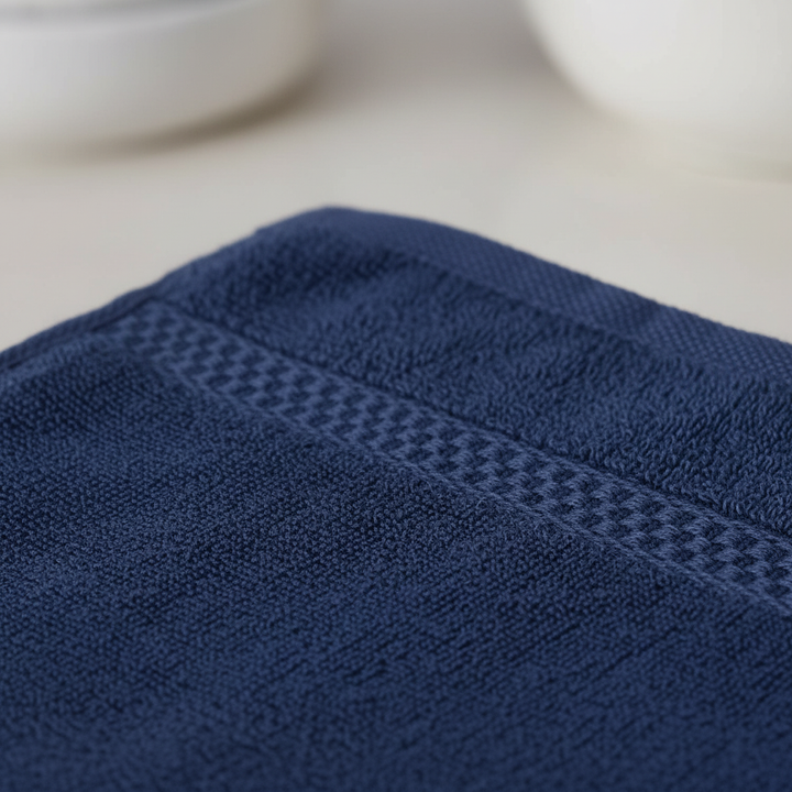 Close-up of a premium white cotton washcloth, highlighting its soft texture and absorbency