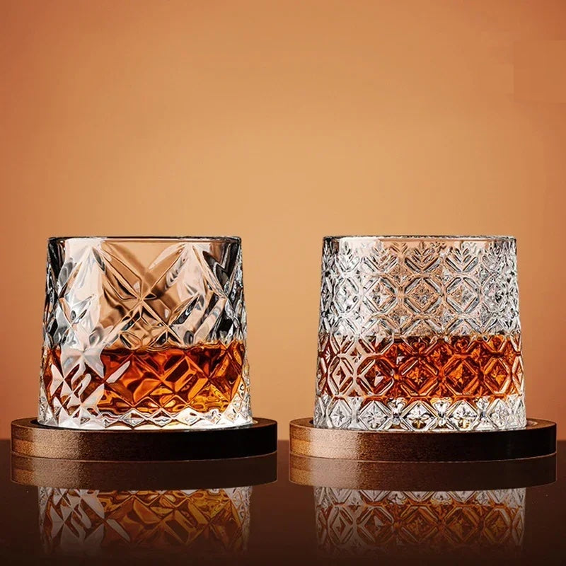 Close-up of a sparkling crystal whiskey glass next to its custom-fitted wooden base, ready for spirits or bourbon.
