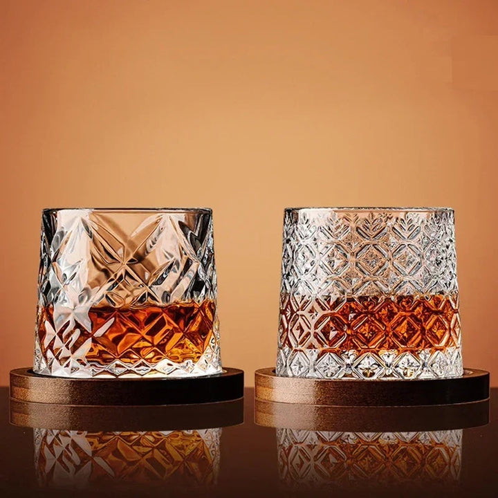 Close-up of a sparkling crystal whiskey glass next to its custom-fitted wooden base, ready for spirits or bourbon.