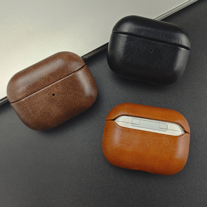 Protective leather AirPods case for earbuds. Supports wireless charging. A durable and premium tech accessory.