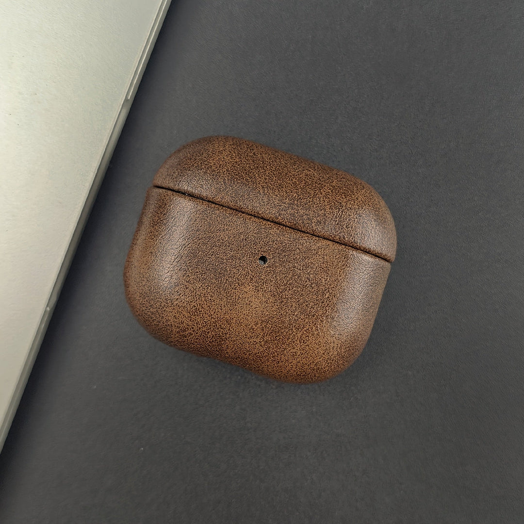 Elegant leather AirPods case. Offers premium protection and wireless charging support for your earbuds.