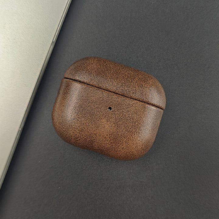 Elegant leather AirPods case. Offers premium protection and wireless charging support for your earbuds.