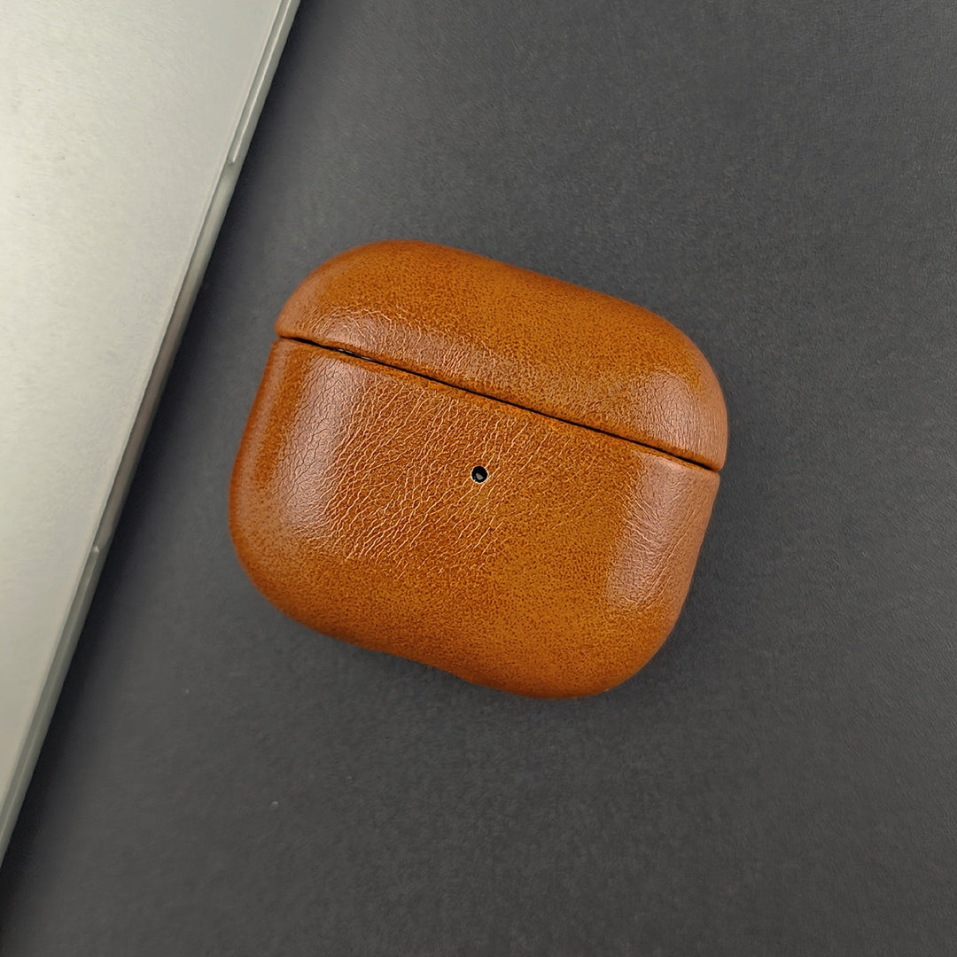 Premium full grain leather earbud case. Durable protection for AirPods, designed for wireless charging convenience.