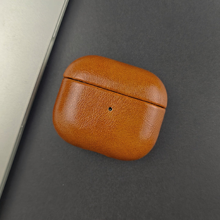 Premium full grain leather earbud case. Durable protection for AirPods, designed for wireless charging convenience.