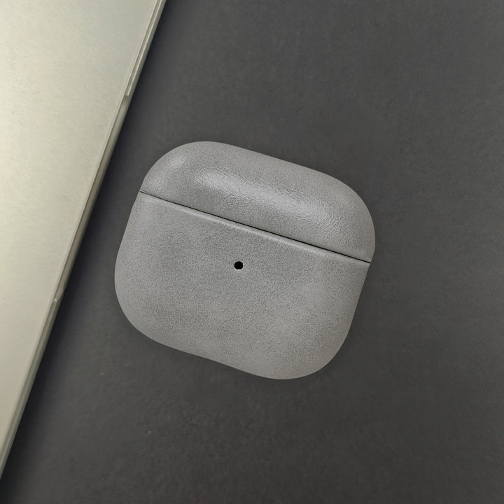 Stylish leather protective AirPods case. A premium tech accessory ensuring durable protection for your earbuds.
