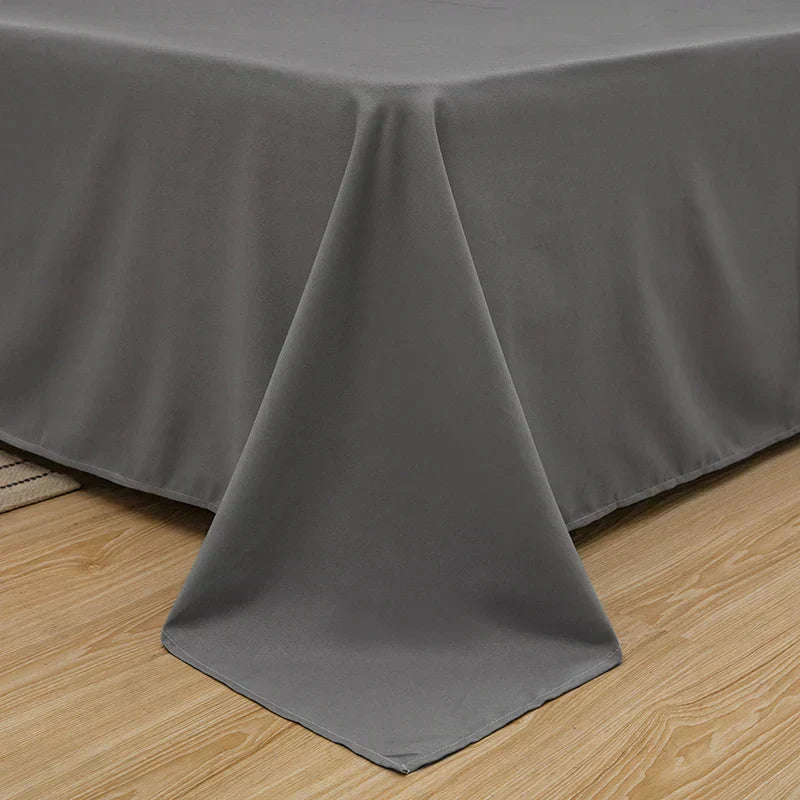 Unfolded soft linen duvet cover, draping beautifully on a bed, providing luxurious comfort and elegant bedding.