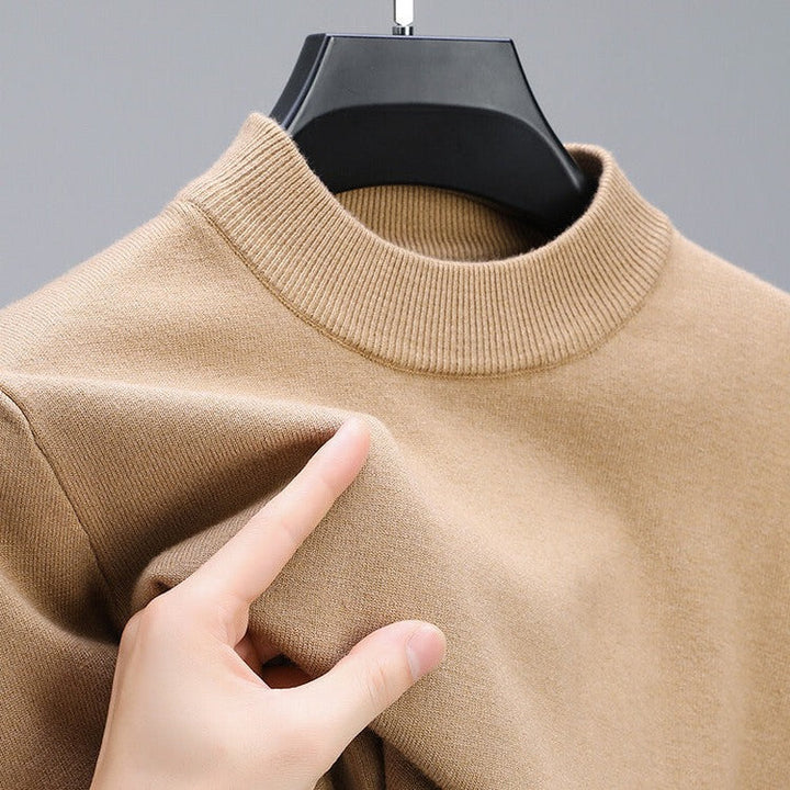 Premium men's cashmere sweater with elegant hem, perfect for sophisticated layering and comfort.