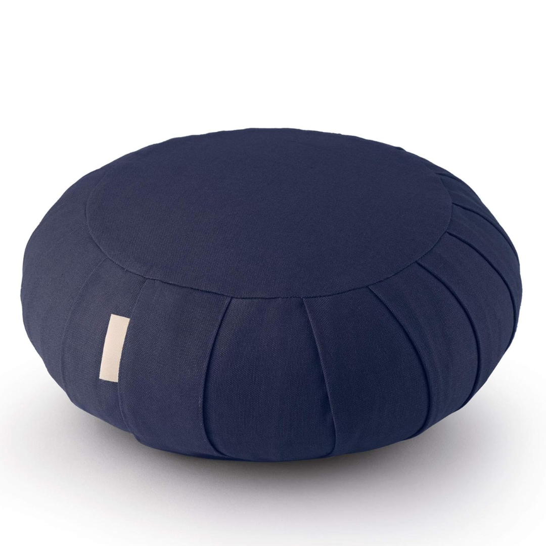 Close-up of organic cotton meditation cushion texture, highlighting quality fabric and buckwheat filling.