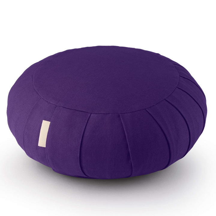 Natural buckwheat meditation pillow with durable organic cotton cover, offering firm support & relaxation.