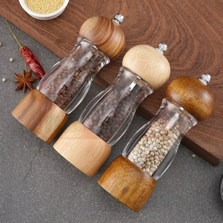 Elegant wooden salt and pepper mill set, showing natural grain texture, manual spice grinders.