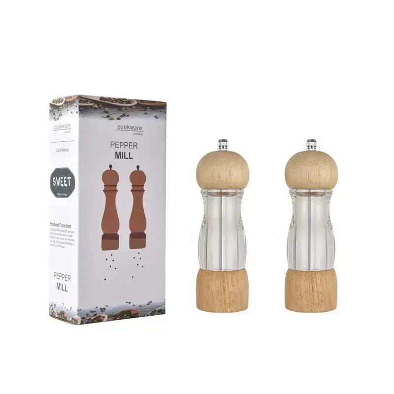 Matching premium wood salt and pepper grinder set, manual spice mills for elegant kitchen seasoning.