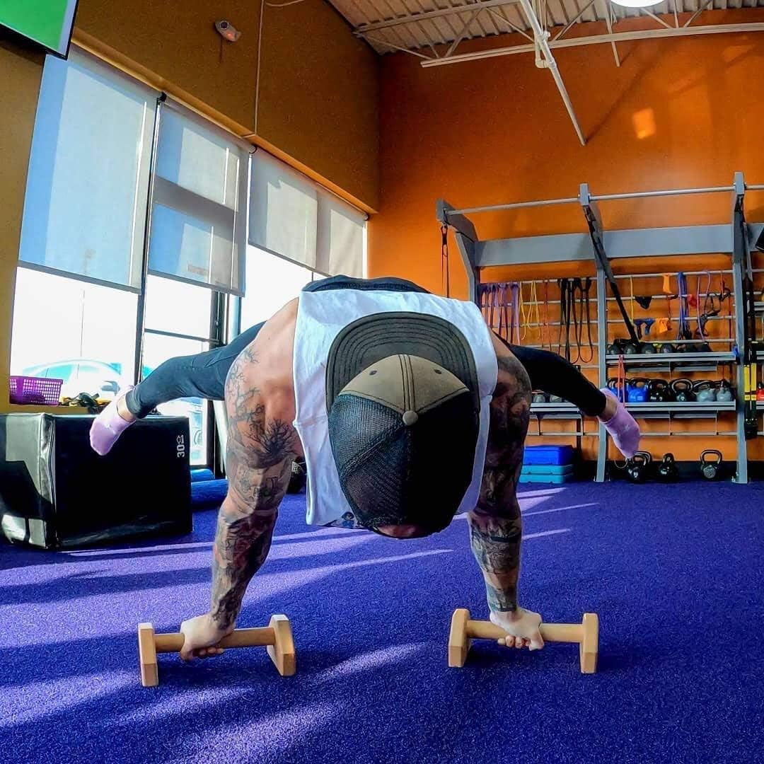 Train dips & push-ups with premium wooden parallettes; ideal portable bodyweight fitness equipment.