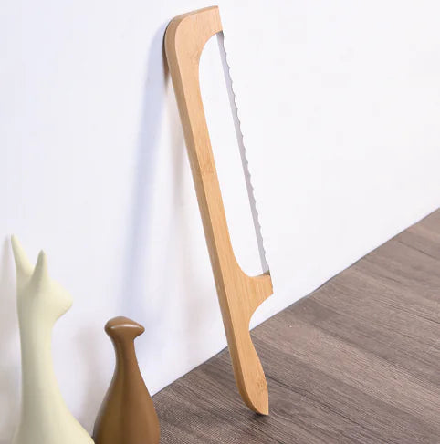 Effortlessly slice crusty artisan bread with this professional stainless steel bread knife.